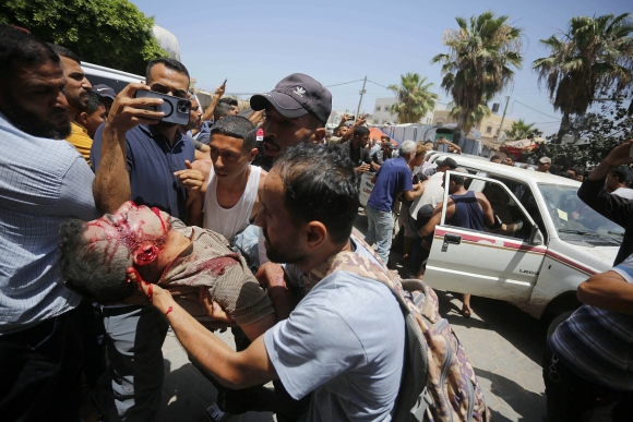 1 Nguoi Gaza Ke Ve Man Lua Israel Chup Xuong De Cuu 4 Con Tin